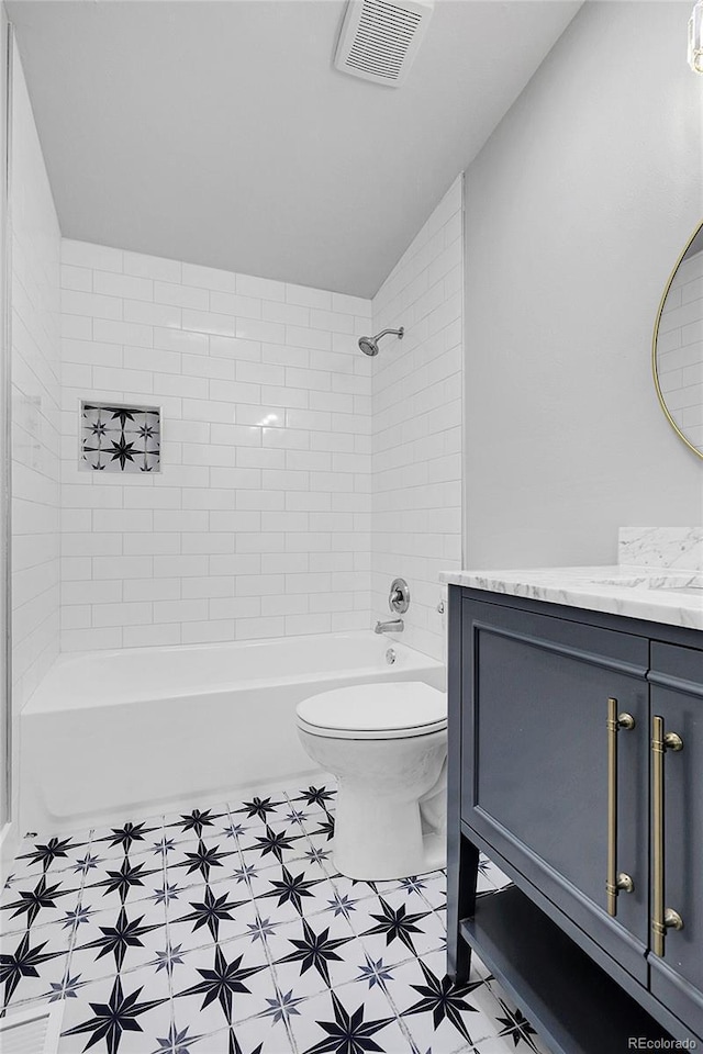 5373 S Prescott St, Littleton, CO 80120 - bathroom featuring toilet, vanity, shower / bathtub combination, and vaulted ceiling