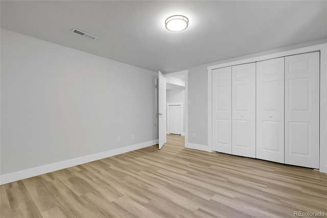 5373 S Prescott St, Littleton, CO 80120 - unfurnished bedroom with light wood-style flooring, baseboards, and a closet