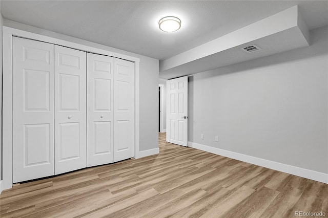 5373 S Prescott St, Littleton, CO 80120 - unfurnished bedroom with light wood-style flooring, baseboards, and a closet