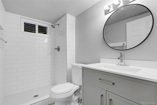5373 S Prescott St, Littleton, CO 80120 - bathroom with toilet, tiled shower, and vanity