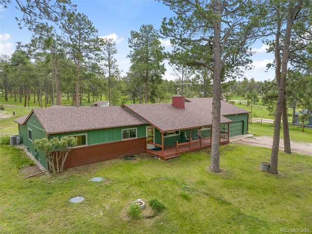 13365 Meadow Glen Ln, Colorado Springs, CO 80908 - view of front facade with a shingled roof, a front lawn, and driveway