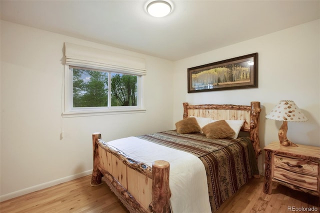 13365 Meadow Glen Ln, Colorado Springs, CO 80908 - bedroom with light wood-style floors and baseboards