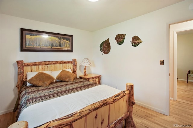 13365 Meadow Glen Ln, Colorado Springs, CO 80908 - bedroom with baseboards and light wood finished floors