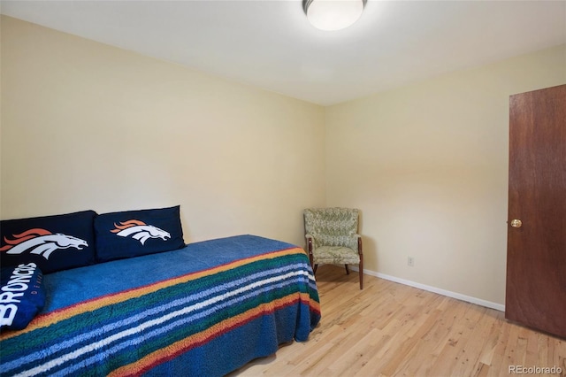 13365 Meadow Glen Ln, Colorado Springs, CO 80908 - bedroom featuring light wood-type flooring and baseboards