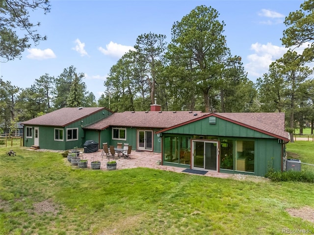 13365 Meadow Glen Ln, Colorado Springs, CO 80908 - rear view of property with a patio and roof with shingles