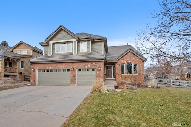 view of front of house with a garage and a front lawn