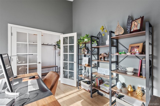 office space with french doors and wood-type flooring