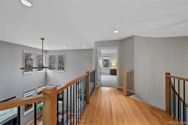 hall with light hardwood / wood-style floors