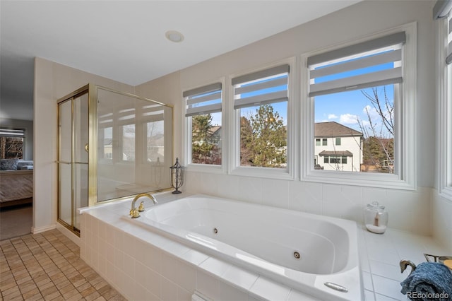 bathroom with tile patterned flooring and separate shower and tub