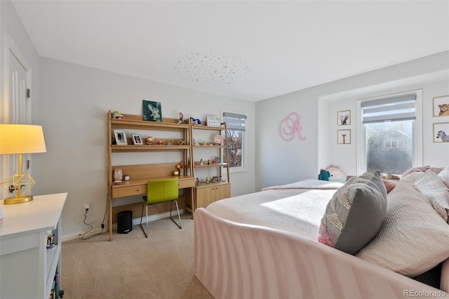 carpeted bedroom featuring multiple windows