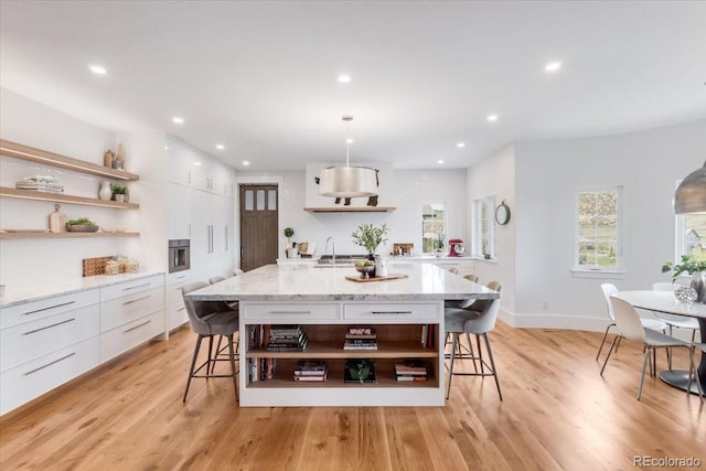 15116 Lyons Ridge Dr, Morrison, CO 80465 - kitchen with a kitchen breakfast bar, open shelves, and modern cabinets