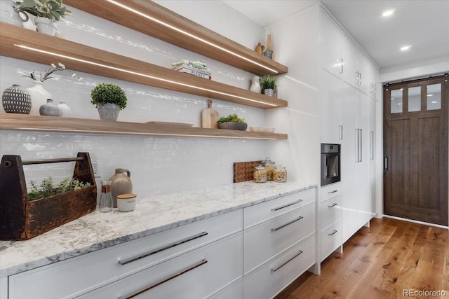 15116 Lyons Ridge Dr, Morrison, CO 80465 - bar with recessed lighting, light wood-style flooring, and oven