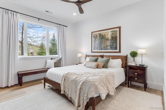 15116 Lyons Ridge Dr, Morrison, CO 80465 - bedroom with baseboards, visible vents, ceiling fan, and light wood finished floors