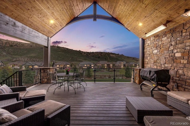 15116 Lyons Ridge Dr, Morrison, CO 80465 - wooden terrace with a mountain view, area for grilling, and outdoor dining space