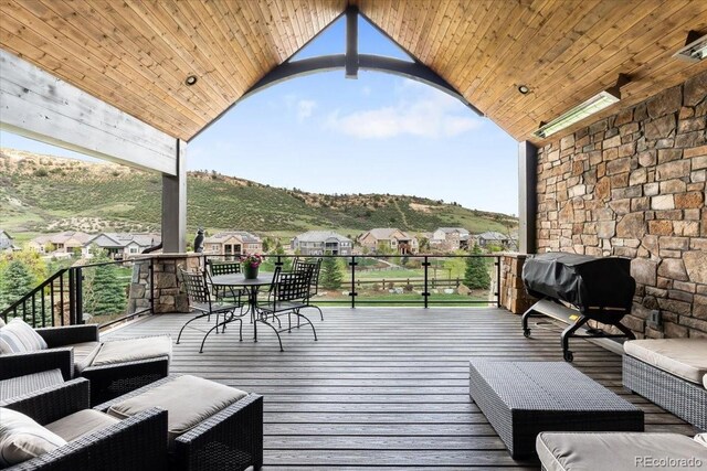 15116 Lyons Ridge Dr, Morrison, CO 80465 - wooden terrace featuring an outdoor hangout area, outdoor dining space, and a mountain view