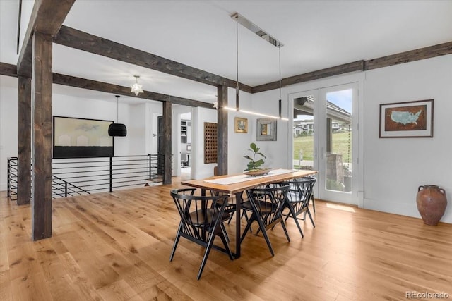 15116 Lyons Ridge Dr, Morrison, CO 80465 - dining area featuring wood finished floors and beamed ceiling