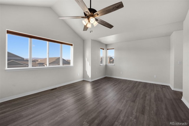 spare room with dark hardwood / wood-style flooring, ceiling fan, and lofted ceiling