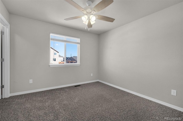 empty room featuring ceiling fan and carpet floors