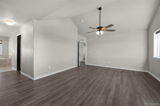 unfurnished living room featuring dark hardwood / wood-style floors, vaulted ceiling, and ceiling fan