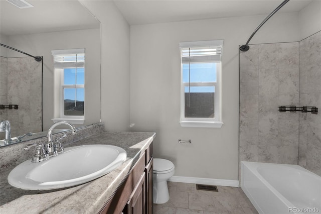 full bathroom with tile patterned floors, vanity, toilet, and tiled shower / bath