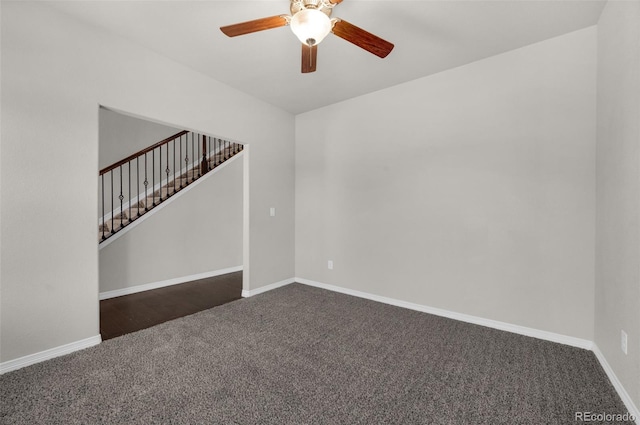 6677 Lamine Dr, Colorado Springs, CO 80925 - spare room with stairway, dark carpet, baseboards, and a ceiling fan