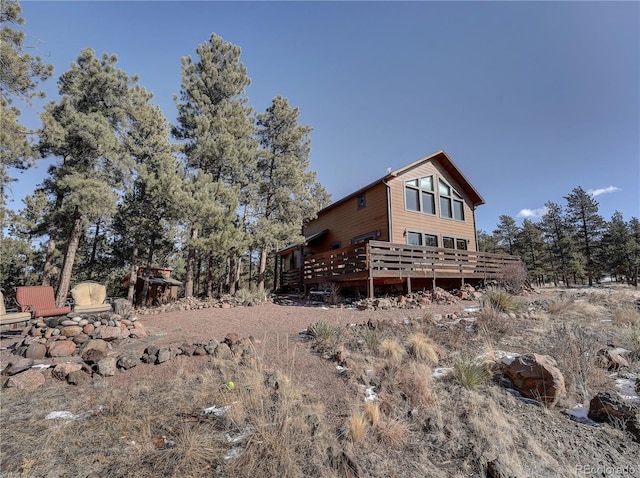 back of property with a wooden deck