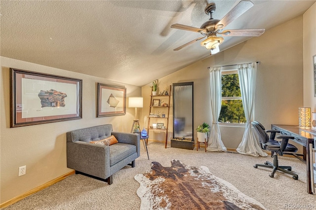 office space featuring light carpet, ceiling fan, a textured ceiling, and lofted ceiling