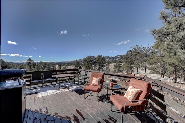 wooden terrace with a mountain view