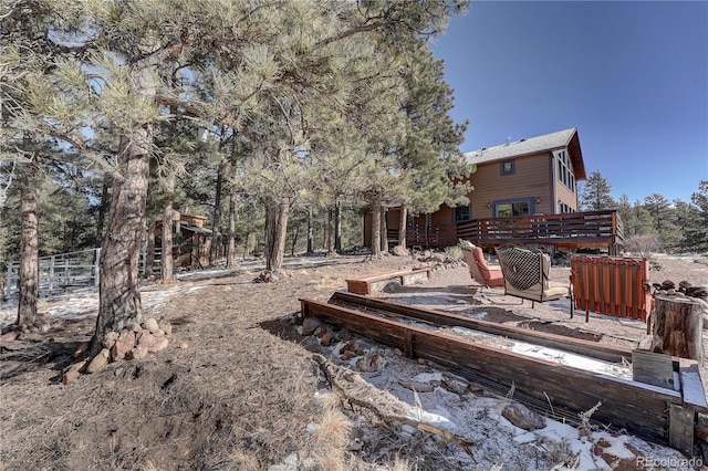 view of yard featuring a wooden deck