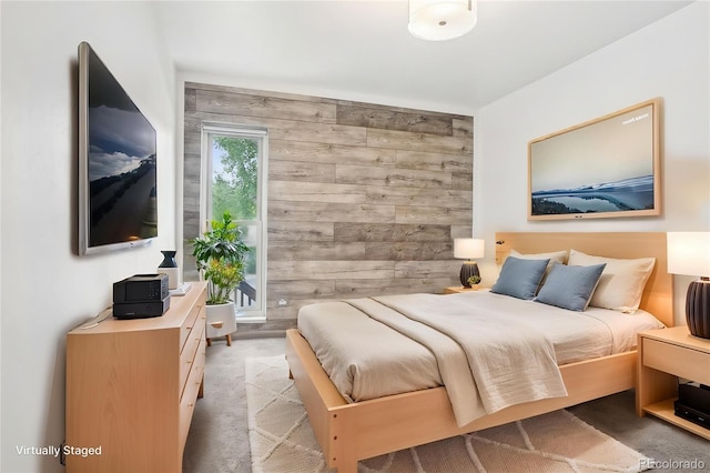 3663 S Sheridan Blvd Unit H15, Denver, CO 80235 - bedroom with light colored carpet and wood walls