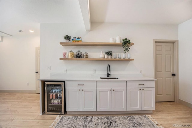 7410 Winter Berry Ln, Castle Pines, CO 80108 - indoor bar with wine cooler, light wood-type flooring, and recessed lighting