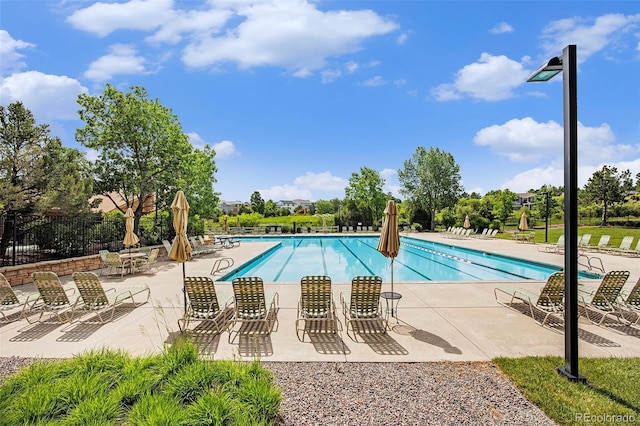 7410 Winter Berry Ln, Castle Pines, CO 80108 - community pool with a patio