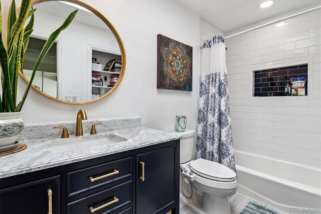 full bathroom with shower / bath combination with curtain, vanity, and toilet