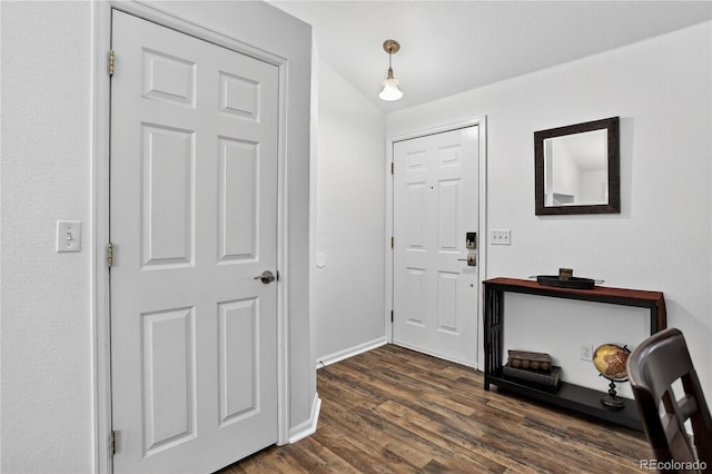 5337 S Ukraine Way, Aurora, CO 80015 - foyer entrance with dark wood-style floors and baseboards