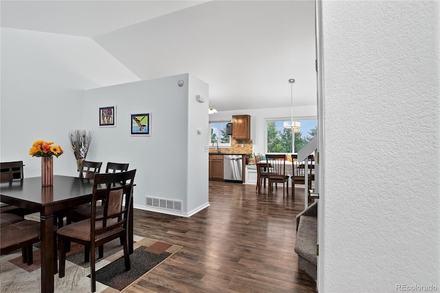 5337 S Ukraine Way, Aurora, CO 80015 - dining room with vaulted ceiling and dark wood-style flooring