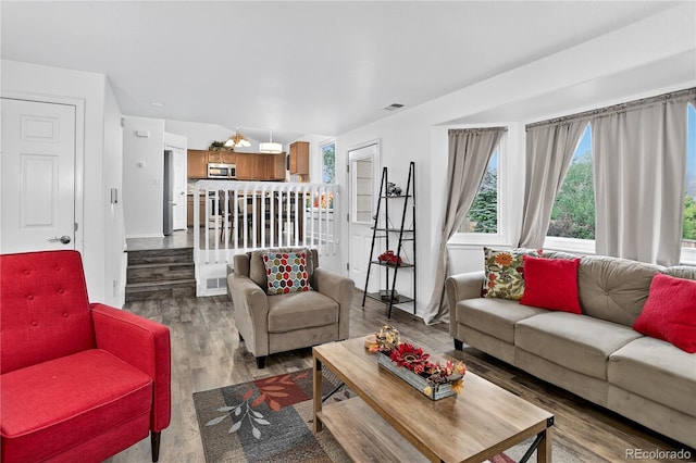 5337 S Ukraine Way, Aurora, CO 80015 - living room featuring wood finished floors and baseboards