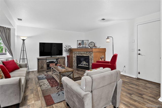 5337 S Ukraine Way, Aurora, CO 80015 - living area featuring wood finished floors and a glass covered fireplace