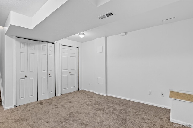 5337 S Ukraine Way, Aurora, CO 80015 - unfurnished bedroom with carpet floors and two closets