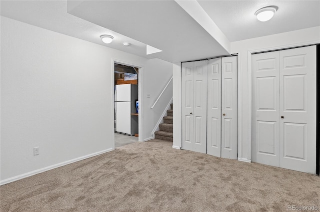 5337 S Ukraine Way, Aurora, CO 80015 - unfurnished bedroom featuring freestanding refrigerator and carpet flooring