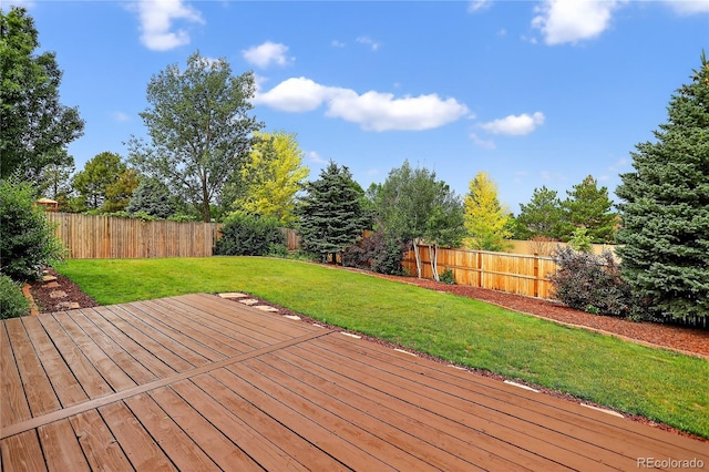 5337 S Ukraine Way, Aurora, CO 80015 - wooden terrace featuring a fenced backyard