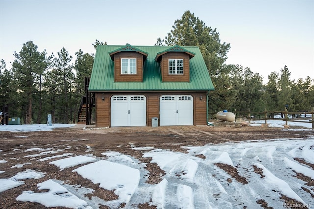 view of snow covered garage