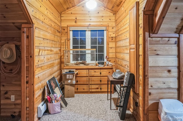 interior space featuring wood walls, wood ceiling, and vaulted ceiling