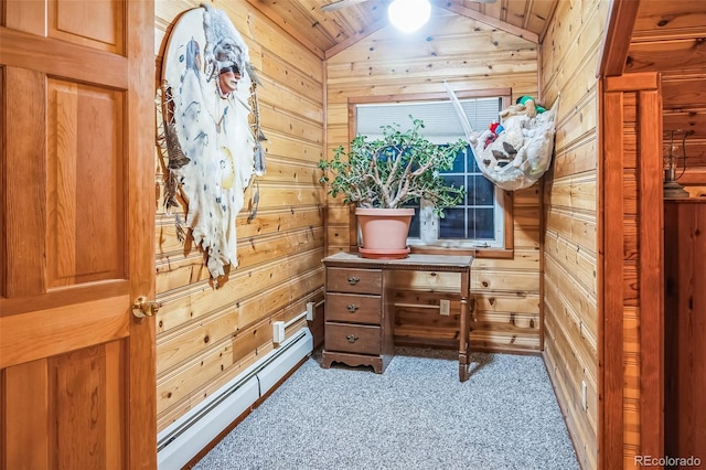 interior space with a baseboard heating unit, light colored carpet, ceiling fan, and lofted ceiling