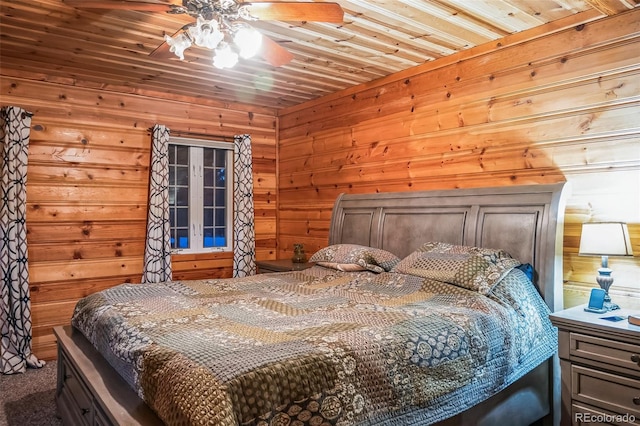 carpeted bedroom with wooden walls, ceiling fan, and wooden ceiling