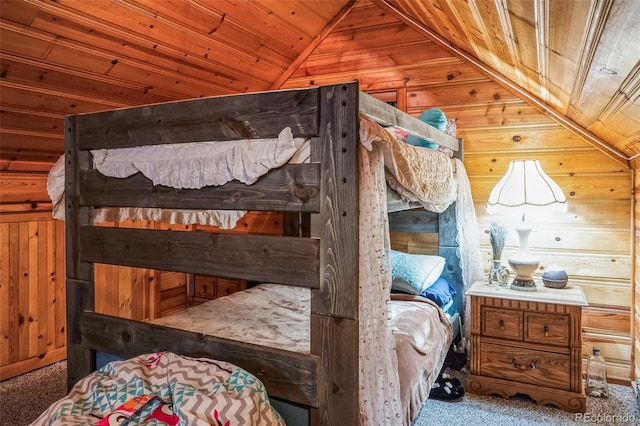 carpeted bedroom featuring wooden walls, wooden ceiling, and lofted ceiling