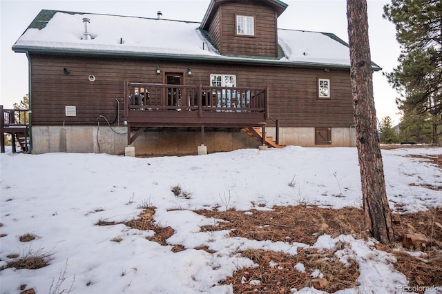 view of snow covered house