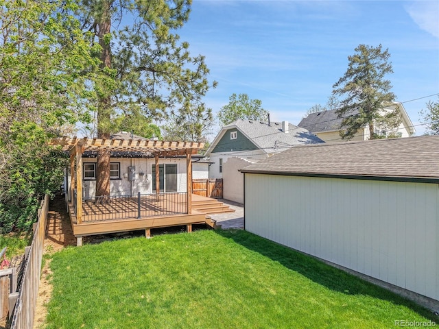 rear view of property featuring a pergola, a deck, and roof with shingles
