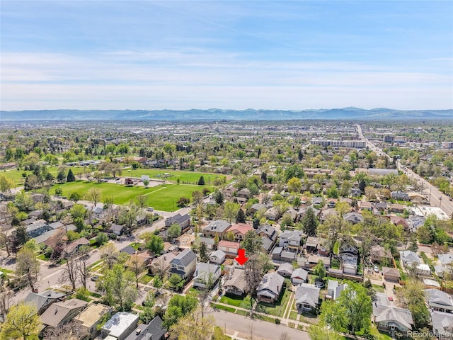 aerial view of residential area featuring a mountain backdrop