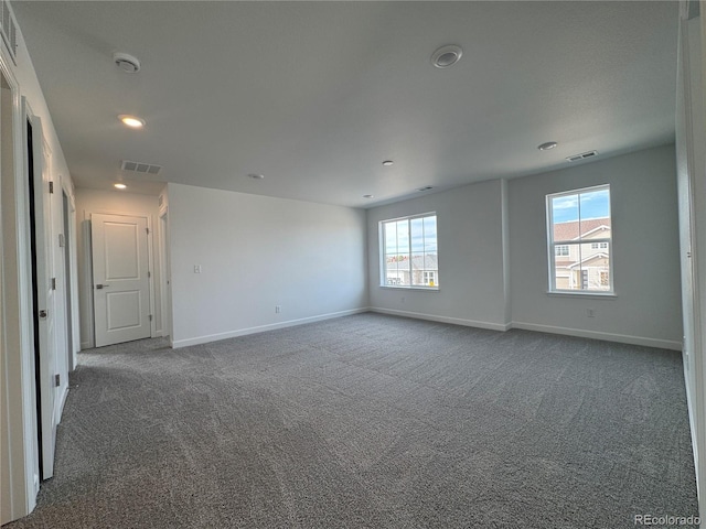 carpeted empty room with recessed lighting, baseboards, and visible vents