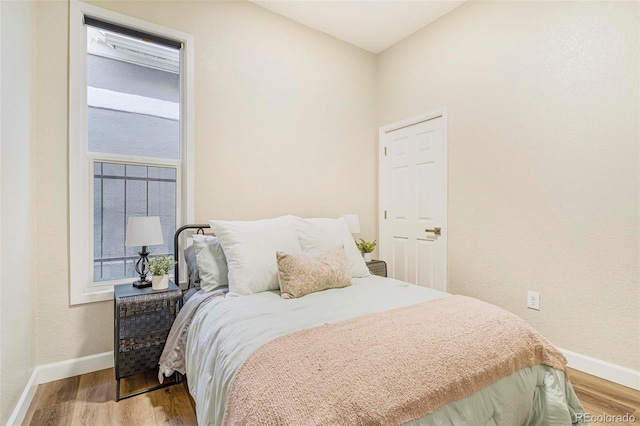 bedroom with light hardwood / wood-style flooring